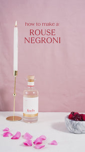 Negroni cocktail recipe made with Rouse Eau De Vie Spirit bottle by Feels Botanical, featuring floral & sensual rose, musk, & rhubarb aromas
