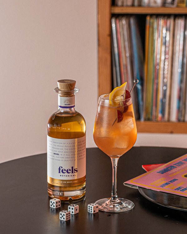Cocktail made with Revel Eau De Vie Spirit bottle by Feels Botanical, with lively fruit, spice & smooth chocolate notes