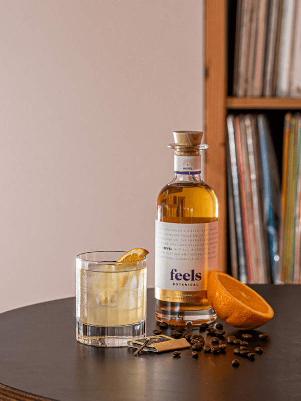 Cocktail made with Revel Eau De Vie Spirit bottle by Feels Botanical, with lively fruit, spice & smooth chocolate notes