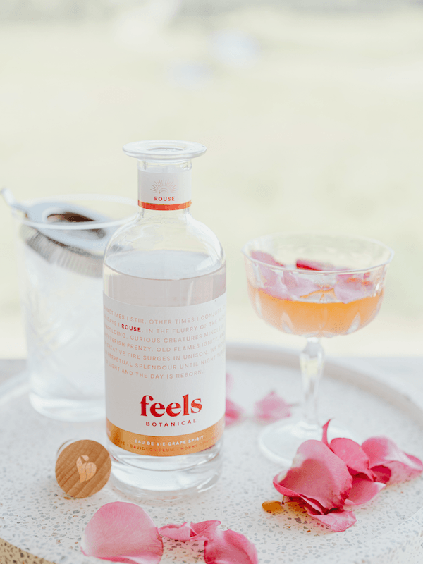 Unique cocktail made with Rouse Eau De Vie Spirit by Feels Botanical, featuring floral & sensual rose, musk, & rhubarb aromas