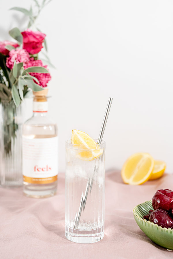 Unique cocktail made with Rouse Eau De Vie Spirit by Feels Botanical, featuring floral & sensual rose, musk, & rhubarb aromas